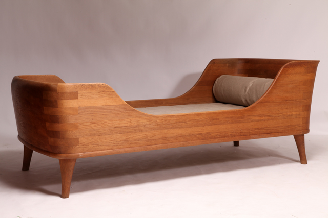 Boat-shaped bed of solid oak in the style of Peder Moos