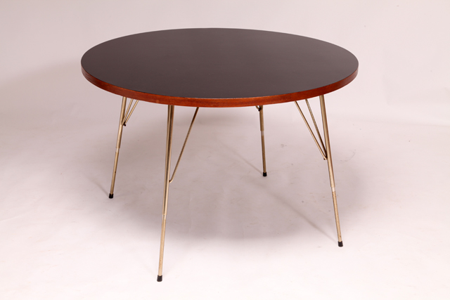 Round dining table adjustable in height by Rudolf Wolf